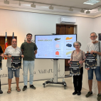 Presentació de la programació del Nou d'Octubre a la Vall d'Uixó, amb els cartells de la Cercavila de la Conquesta 2026 i la imatge de la campanya  Confluències .